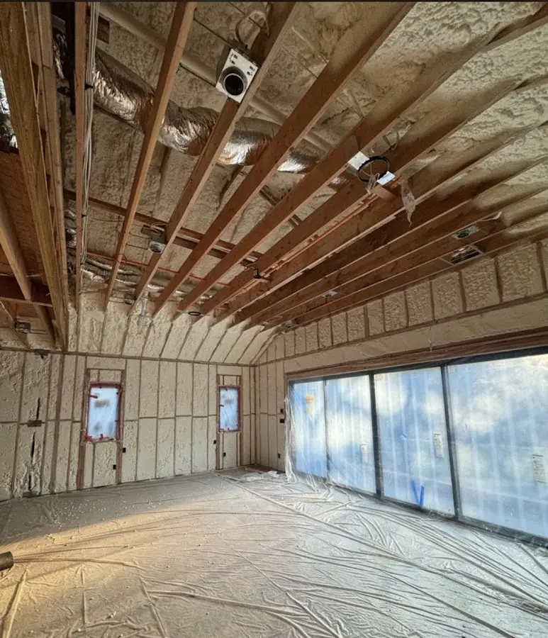 Interior walls and ceiling insulated with spray foam during new construction in Grand Forks